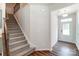 Modern staircase with carpet runner and wrought iron railing at 14930 Tamarack Dr, Charlotte, NC 28278