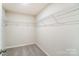 Large walk-in closet with wire shelving at 14930 Tamarack Dr, Charlotte, NC 28278
