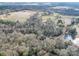 Aerial view of home, pond, and large lot at 1515 Hasty Rd, Marshville, NC 28103