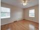 Bedroom with hardwood floors and two windows with blinds at 1515 Hasty Rd, Marshville, NC 28103