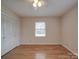 Bedroom with hardwood floors, window, and built-in closet at 1515 Hasty Rd, Marshville, NC 28103