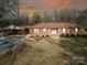 Brick ranch house with attached carport and landscaped yard at 1515 Hasty Rd, Marshville, NC 28103