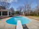 Inviting kidney-shaped pool with diving board at 1515 Hasty Rd, Marshville, NC 28103