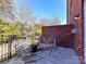 Relaxing back patio with seating area and brick wall at 203 Pine Needles Ln, Fort Mill, SC 29708