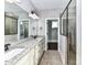 Elegant bathroom with double vanity, granite countertop, and a walk-in shower at 203 Pine Needles Ln, Fort Mill, SC 29708