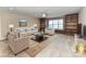 Living Room with built in shelving and neutral colored furniture at 203 Pine Needles Ln, Fort Mill, SC 29708