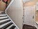 Staircase with dark wood treads and white risers at 203 Pine Needles Ln, Fort Mill, SC 29708