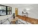 Bright living room with a statement wall and hardwood floors at 3410 Mathis Dr, Charlotte, NC 28208