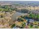 Aerial view of property showcasing a house, pool, and lakefront location at 361 Iron Club Dr, York, SC 29745