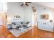 Light-filled living room with hardwood floors, sectional sofa and fireplace at 361 Iron Club Dr, York, SC 29745