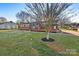 Brick ranch home with a spacious yard and American flag at 413 N Mulberry St, Cherryville, NC 28021