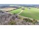 Aerial view of house and large lot, farmland visible at 4621 Wolf Pond Rd, Monroe, NC 28112