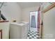 Laundry room with washer, dryer, and access to stairs at 4621 Wolf Pond Rd, Monroe, NC 28112