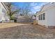 Spacious backyard with a large grassy area and a grey block wall at 520 W 5Th Ave, Gastonia, NC 28052