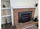 Brick fireplace with built-in shelving on either side at 549 Dairy Rd, Troy, NC 27371