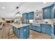 Bright kitchen with island, farmhouse sink, granite countertops, and stainless steel appliances at 549 Dairy Rd, Troy, NC 27371