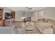 Cozy living room with wood floors, neutral paint, ceiling fan, and plenty of natural light at 549 Dairy Rd, Troy, NC 27371