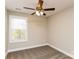 Bright bedroom with ceiling fan and window coverings at 571 Westside Cir, China Grove, NC 28023