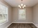 Dining room featuring hardwood floors and a chandelier at 571 Westside Cir, China Grove, NC 28023