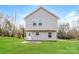Well-maintained house with grassy backyard and concrete patio at 571 Westside Cir, China Grove, NC 28023