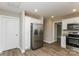 Kitchen with stainless steel refrigerator and white cabinets at 571 Westside Cir, China Grove, NC 28023