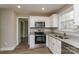 Modern kitchen with white cabinets, granite counters, and stainless steel appliances at 571 Westside Cir, China Grove, NC 28023