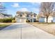 Two-story house with attached two-car garage and neat landscaping at 6146 Creekview Ct, Harrisburg, NC 28075