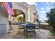 Lakefront patio with dining table and grilling station at 618 Portside Dr, Davidson, NC 28036