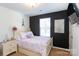 Charming bedroom with Eiffel Tower decor and white dresser at 6307 Pennacook Dr, Charlotte, NC 28214