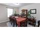 Formal dining room with a large table and antique china cabinet at 6307 Pennacook Dr, Charlotte, NC 28214