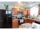 Kitchen with stainless steel appliances and wood cabinets at 6307 Pennacook Dr, Charlotte, NC 28214