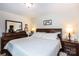 Main bedroom with a king-size bed and a dresser at 6307 Pennacook Dr, Charlotte, NC 28214