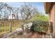 Deck with wicker chair and side table, overlooking trees at 6520 Weldon Nw Cir, Concord, NC 28027