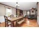 Bright dining area with hardwood floors and wood table at 6520 Weldon Nw Cir, Concord, NC 28027