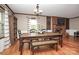 Dining room with hardwood floors, fireplace and large windows at 6520 Weldon Nw Cir, Concord, NC 28027