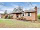 Brick ranch house with landscaped lawn and walkway at 6520 Weldon Nw Cir, Concord, NC 28027