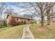 Brick ranch house with a landscaped yard and walkway at 6520 Weldon Nw Cir, Concord, NC 28027