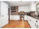 Updated kitchen with white cabinets, granite countertops and brick backsplash at 6520 Weldon Nw Cir, Concord, NC 28027