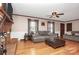 Living room boasts hardwood floors, a fireplace, and comfy gray sofas at 6520 Weldon Nw Cir, Concord, NC 28027
