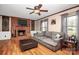 Living room with hardwood floors, a brick fireplace, and a cozy atmosphere at 6520 Weldon Nw Cir, Concord, NC 28027