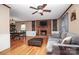 Living area features hardwood floors, a fireplace, and a spacious layout at 6520 Weldon Nw Cir, Concord, NC 28027