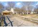 Long driveway with wooden fence and attached garage at 6601 Porterfield Rd, Charlotte, NC 28226