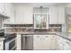 Modern kitchen with stainless steel appliances and tile backsplash at 6601 Porterfield Rd, Charlotte, NC 28226