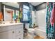 Modern bathroom with a white vanity and a teal shower curtain at 7025 Old Evergreen Pkwy, Indian Trail, NC 28079