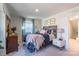 Cozy bedroom with a wooden headboard and colorful bedding at 7025 Old Evergreen Pkwy, Indian Trail, NC 28079
