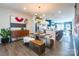 Open concept dining area with glass table, bench seating, and modern chandelier at 7025 Old Evergreen Pkwy, Indian Trail, NC 28079