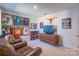 Fun game room with sports memorabilia and comfy seating at 7025 Old Evergreen Pkwy, Indian Trail, NC 28079
