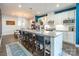 Modern kitchen with white cabinets, granite island, and stainless steel appliances at 7025 Old Evergreen Pkwy, Indian Trail, NC 28079