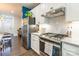 Modern kitchen with white cabinets, granite countertops and stainless steel appliances at 7025 Old Evergreen Pkwy, Indian Trail, NC 28079