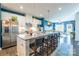Modern kitchen with white cabinets, granite island, and stainless steel appliances at 7025 Old Evergreen Pkwy, Indian Trail, NC 28079